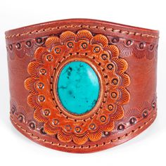 Western style hand-tooled vegetable tanned cowhide leather cuff bracelet is hand made by American Darling.A unique design pattern that catches the eye with its undeniable charm.The handmade leather bracelet is a go-to for your western look with any outfit you choose to slay in.2 snap button closure options to fit your wrist accordingly. Artisan Hand-stitched Adjustable Jewelry, Hand-stitched Adjustable Bohemian Jewelry, Southwestern Hand Tooled Leather Bracelets, Brown Bohemian Leather Bracelet With Concho, Vintage Hand-tooled Leather Cuff Bracelet, Rustic Hand Tooled Adjustable Bracelets, Bohemian Hand-tooled Cuff Bracelet, Handmade Western Style Turquoise Bracelet, Handmade Western Turquoise Bracelets