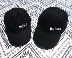 "Mama Heart and Mini Heart Hat. This listing is for TWO (2) Adjustable Dad Hat that says \"mama\" and \"mini\" with a heart in a cute font. Each set of 2 comes with one adult size dad hat, and one youth size dad hat. * Classic \"dad\" style hats * 100% bio-washed chino twill * Pre-curved visor * Unstructured, six-panel, low-profile * Adjustable buckle closure - antique brass * One adult hat and one youth hat * Youth size fits most kids and young adults Check out our policy page for return / exch Mama Hat, Dad Style, Mommy Daughter Outfits, Cute Font, Mini Hats, Matching Hats, Mama And Mini, Mini Hat, Dad Fashion