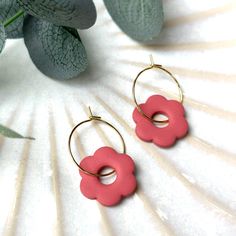 Colourful floral hoop earrings handmade from Polymer Clay. They are incredibly light and comfortable to wear.  Finished with a hypoallergenic 18ct gold plated ear-wire.  They are lead and nickel free. Dimensions: Hoop Circumference - 20mm Flower Width - 20mm Total Length - 30mm Approximately 2-3mm thick Handcrafted: I handmake all of my polymer clay jewellery.  I mix the colours, cut and bake the clay, sand and finish it by attaching good quality hypoallergenic findings that are lead and nickel Everyday Flower Charm Hoop Earrings, Everyday Pink Jewelry With Flower Charm, Everyday Flower Hoop Earrings, Everyday Flower Shaped Hoop Earrings, Adjustable Flower Hoop Earrings For Everyday, Pink Flower Jewelry For Everyday, Small Hoop Earrings With Flower Charm As Gift, Dainty Pink Hoop Earrings For Everyday, Minimalist Everyday Earrings With Flower Charm