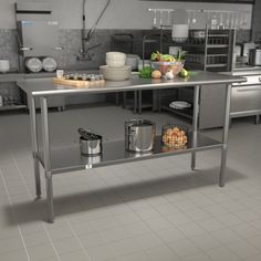 an industrial style kitchen with stainless steel tables and pots, pans and utensils