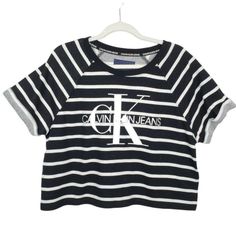 Calvin Klein Jeans Black White Striped Crop T-Shirt French Terry Logo Size Large. - Black White Stripe. - Cropped Length. - Short Sleeves. - Logo Front. - French Terry Cloth. New With Tags. Measurements (Approximate Flat Lay): Pit To Pit: 24" Length: 22" Calvin Klein Short Sleeve Streetwear Top, Sporty Calvin Klein Tops With Logo Print, Calvin Klein Graphic Print T-shirt For Summer, Calvin Klein Summer Logo Print Top, Calvin Klein Summer Graphic Print T-shirt, Calvin Klein White T-shirt For Streetwear, Calvin Klein Casual Tops For Streetwear, Casual Calvin Klein Tops For Streetwear, Casual Calvin Klein Tops With Letter Print