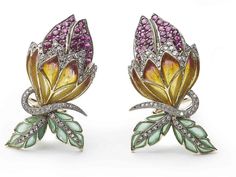 A pair of Moira bud earrings, with orange and yellow plique à jour enamel sepals and green leaves, with pavé set rubies and diamonds, mounted in gold, with silver settings. Numbered. Moira's eponymous collection was inspired by clients searching for unusual jewellery that just couldn't be sourced anywhere. Influenced by nature itself, Moira put together a collection representing the forms of flora and fauna, employing what are now rare traditional setting techniques, old-cut stones and enamel in Diamond Flower Earrings, Rubies And Diamonds, Moonstone Drop Earrings, Bijoux Art Nouveau, Diamond Cluster Earrings, Pearl And Diamond Earrings, Unusual Jewelry, Green Agate, Orange And Yellow