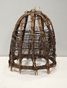 a wicker basket sitting on top of a white table