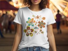 The Retro Flowers T-Shirt is a perfect blend of vintage charm and modern style. This Floral Shirt is ideal for summer and makes a thoughtful Gift For Mom. The Retro Wildflower Tshirt features a beautiful boho design, making it a stylish Boho Shirt for any nature lover. The Retro Floral Tee showcases intricate botanical details, making it a must-have Nature Lover Shirt and Wildflower Shirt. It also serves as a Botanical Shirt and Vintage Floral Shirt for those who appreciate classic floral design White Vintage Print T-shirt For Spring, White Retro Print Tops For Spring, Spring White Top With Retro Print, Vintage White T-shirt With Floral Print, Vintage Custom Print Tops For Spring, White T-shirt With Retro Print For Spring, White Retro T-shirt With Floral Print, White T-shirt With Vintage Print For Spring, White Retro Print Shirt For Spring