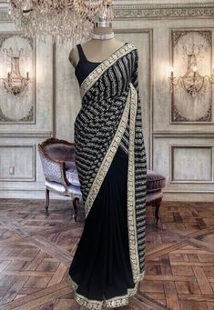 Beautiful jet black georgette saree with stitched black sleeveless blouse. Black Pre-draped Saree With Dupatta For Reception, Traditional Black Pre-draped Saree, Festive Black Pre-draped Saree With Cutdana, Black Pre-draped Saree With Pallu For Festive Occasions, Formal Black Pre-draped Saree With Resham Embroidery, Designer Black Blouse For Navratri, Designer Black Blouse Piece For Navratri, Designer Black Blouse Piece For Festivals, Black Georgette Pre-draped Saree With Resham Embroidery