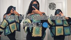 a woman taking a selfie in front of a mirror wearing a granny off the shoulder sweater