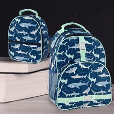 See store for other patterns! Perfectly sized for school age kids, these bags are large enough to carry your children's school books and required day-to-day school supplies and still leave room for a change of clothes for playtime after class. All Over Print Backpacks are durable enough that they also make for a great summer camp or sports bag. This backpack has many of the same features found on adult size bags- three storage compartments, padded and adjustable shoulder straps for comfort, double sided mesh water bottle pockets, two outside hook-on straps, and an inside elastic pocket with name tag. Be sure to gear up with the matching Stephen Joseph All Over Print Lunchboxes. Want to make it even more individual? Then why not personalize it with your child's initials or name?   Backpack Cute School Lunch Bag For Back To School, Cute Lunch Bag For Back To School, Cute Back To School Lunch Bag, Cute Lunch Bag For School Year End, Blue Lunch Bag For Back To School, Playful Rectangular Backpack For School, Playful Green Lunch Bag For School, Everyday Use Backpack, School Backpack For Back To School