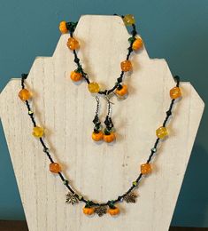 3 pc set Pumpkin, fall, autumn lover jewelry set. Glass beads with metal leaves scattered in between beads. Necklace is 21" with a toggle clasp. The bracelet is 9" with a twist clasp and then a pair of matching pierced earrings. Bohemian Adjustable Jewelry For Fall, Handmade Adjustable Jewelry For Fall, Adjustable Bohemian Jewelry For Fall, Adjustable Handmade Jewelry For Fall, Autumn Jewelry, Autumn Bracelet, Lover Jewelry, Autumn Necklace, Metal Leaves