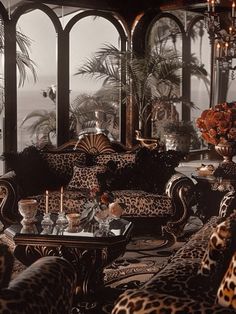 a living room filled with leopard print furniture