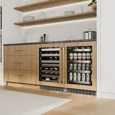 a kitchen with wooden cabinets and white rug on the floor next to an open refrigerator