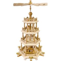 a wooden model of a tower with people on it and a fan hanging from the top