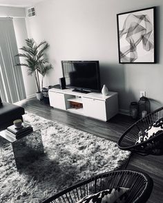 a black and white photo of a living room