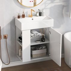 a white sink sitting under a mirror in a bathroom