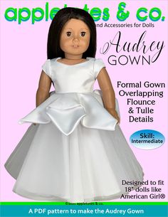 the doll is wearing a white dress