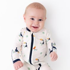 Breathable, super soft, and wildly comfy, our bamboo baby footies will keep your little one snug and stylish on all their adventures. Each footie is made with luxurious, eco-friendly viscose from bamboo fabric for all-over comfort without the negative environmental impact. Wash before first use Machine wash cold, gentle cycle Tumble dry low Iron low if desired Do not bleach 95% Viscose from bamboo, 5% Spandex Feet grips Fold-over mitts Neckline to foot 2 way zipper Concealed zip tab at neckline Playful White Footie For Playtime, Baby Footie Pajamas, Diaper Caddy, Eco Friendly Baby, Footie Pajama, Sleep Sacks, Hooded Towel, Security Blanket, Bamboo Fabric