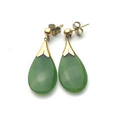 Gorgeous tear drop  dangle earrings. A green gemstone in a smooth pebble tear drop shape, 0.75" by 7/16" and 1/8" thick. Set on a yellow gold for pierced earrings. The push back butterfly are not original. 1 1/8" drop. In excellent condition with expected signs of wear. The stone has no cracks nor scratches. The gold has very minor surface scratches. Comes in a gift box, pack with care. Tear Drop Earrings, Insect Jewelry, Vintage Navajo, Drop Dangle Earrings, Green Gemstones, Pierced Earrings, Tear Drop, Teardrop Earrings, Earings Piercings