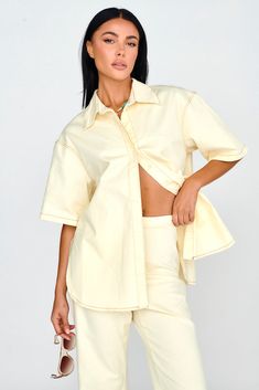 Light Aura Button Up Shirt Buttermilk Cream Short Sleeve Blouse For Summer, Spring Loungewear Short Sleeve Shirt, Summer Loungewear Shirt With Button Closure, Off White Spring Loungewear Top, Summer Lounge Shirt With Button Closure, Chic Relaxed Fit Off White Top, Spring Relaxed Fit Solid Color Shirt, Spring Loungewear Shirt With Button Closure, Beige Relaxed Fit Button-up Top