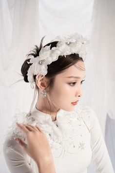 A beautiful traditional dress is always the desire of every girl. Sophisticated and meticulous embellishments, crystals, and pearls together with flowers are very sharp, making the Ao Dai always the center of attention. It is a perfect choice for the big occasion. Note:*Processing time takes 11-14 working days (including 8-10 working days for manufacturing and NOT including shipping time)**Backorder Definition- The product is low in stock and in case the customer purchased successfully after out Elegant White Adjustable Headband, Elegant Headband Headpiece, Elegant Adjustable White Headband, Elegant White Flexible Fit Headband, Elegant Crown Headpiece For Evening, Elegant Adjustable Hair Accessories For Ceremony, Elegant Floral Wedding Headpieces, Elegant Wedding Headpiece With Flower Decoration, Elegant Adjustable Bridal Accessories