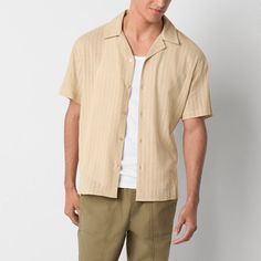 This Arizona Jean Co. men's short-sleeve textured button-down shirt in khaki effortlessly combines comfort and style. It's crafted from 100% cotton and features a slim-fit and a collar neck. Wear yours on its own or layered over a muscle tank for a laid-back look. Closure Type: ButtonFit: Slim FitNeckline: Collar NeckSleeve Length: Short SleeveApparel Length: 29 InchesFiber Content: 100% CottonFabric Description: WovenCare: Tumble Dry, Machine WashCountry of Origin: Imported Beige Camp Shirt With Relaxed Fit And Camp Collar, Khaki Button-up Beach Top, Khaki Button-up Shirt For Summer, Khaki Summer Shirt With Button Closure, Beige Button-up Beach Shirt, Beige Button-up Shirt For Beach, Summer Khaki Shirt With Button Closure, Casual Beige V-neck Shirt, Beige Johnny Collar Shirt With Relaxed Fit