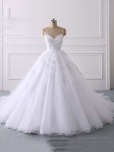 $230.25 -   Key Features: Item Type: Wedding Dresses Sleeve Style: Spaghetti Straps Built-in: Yes Decoration: Appliques Decoration: Lace Neckline: Sweetheart Sleeve Length(cm): Sleeveless Wedding Dress Fabric: Organza and Tulle is_customized: Yes Silhouette: Ball Gown Waistline: Natural Back Design: zipper Fashion Element: simple Actual Images: Yes Brand Name: Bridelily Train: Chapel Train Plus Size: Yes Dresses Length: Floor-Length Color: White / ivory /custom Any questions about the item, feel White V-neck Wedding Dress With Lace Bodice, White V-neck Dress For Debutante Ball, Wedding Dress With Delicate Tulle Straps, Wedding Dress With Sweetheart Neckline And Delicate Straps, V-neck Tulle Wedding Dress, Wedding Tulle Dress With Spaghetti Straps, Tulle Gown With Spaghetti Straps For Debutante Ball, White Ball Gown With Lace Bodice And Sweetheart Neckline, White Sweetheart Neckline Ball Gown For Bridesmaid