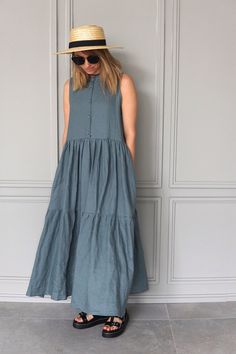 Be relaxed, free and safe in this long linen dress. Unique blue linen dress, made of high-quality linen. Wear it even as a everyday dress. It's extremely versatile maxi dress. This blue summer dress has hidden pockets in the side seams. The dress is without sleeve.  The dress has a high collar and the buttons on the top. It's the romantic dress you have been looking for.  DIDRESS is part of the slow fashion movement. All our products are crafted in our studio in Vilnius, Lithuania. I am a fashio Maxi Dress Linen, Linen Summer Dress, Blue Linen Dress, Fashion Movement, Long Linen Dress, Vilnius Lithuania, Everyday Dress, Linen Summer, Slow Fashion Movement