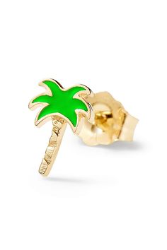 a small green palm tree earring on a gold plated ear studded with an inscription