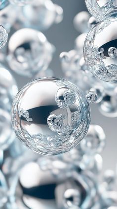 an image of some glass balls floating in the air and looking like they are moving