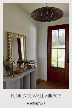 a room with a mirror, vases and other items on the table in front of it