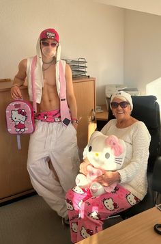 tags: grandma in hello kitty outfit, hello kitty outfit men, hello kitty outfit women, y2k, baby pink outfit, kawaii japanese street style, japanese fashion, jaded london baby pink, beanie, marlon noah, office core, office siren, office glasses, rectangle glasses, marlon noah grandma, hello kitty pyjama pants Hello Kitty Core Aesthetic, Hello Kitty Pyjamas, Y2k Mens Fashion, Baby Pink Outfit, Hello Kitty Outfit, Gyaru Kei, Japanese Street Style, Kitty Outfit