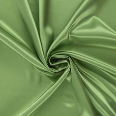 a close up shot of a green satin fabric with very thin lines on the bottom