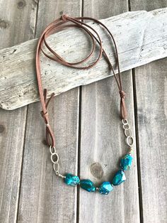 Boho Chic Leather & Chrysocolla Necklace. Leather and Gold. - Etsy Rustic Adjustable Leather Necklace, Adjustable Rustic Leather Necklace, Adjustable Artisan Turquoise Necklace, Artisan Leather Jewelry, Bohemian Brown Turquoise Necklace For Jewelry Making, Bohemian Adjustable Patina Necklace, Handmade Bohemian Leather Necklace, Bohemian Brown Leather Necklace, Handmade Adjustable Brown Turquoise Necklace