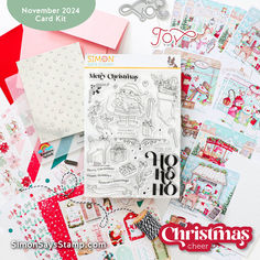 a pile of christmas cards and paper with scissors on top of it, surrounded by other items