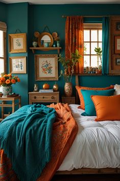 a bedroom with teal walls and orange accents