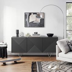 a living room with a white couch and black accents