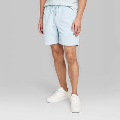 Seven-inch cargo shorts in a light aqua-blue shade. Made from lightweight, stretchy recycled fabric and tailored in a regular-rise cut with a regular fit for comfortable wear. The side and back pockets and two side cargo pockets provide enough space for everyday essentials. A front drawstring waistband completes the design and provides a customizable fit. If you're not satisfied with any Target Owned Brand item, return it within one year with a receipt for an exchange or a refund. Original Use™: Shipt Shopper, Light Aqua, Bottom Clothes, Everyday Essentials, Drawstring Waistband, Recycled Fabric, Aqua Blue, Cargo Shorts, Everyday Essentials Products