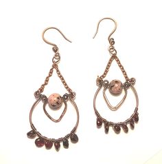 Copper earrings , chandelier style with a center round sesame Jasper orchid bead and it has 6 garnet nugget beads on the bottom.  Ear hooks are attached to the top copper chain.  Earrings have been oxidized and polished for an antique look. Earrings Chandelier, Chandelier Style, Copper Chain, Ear Hook, Wire Earrings, Copper Earrings, Style Earrings, Chain Earrings, Antique Copper