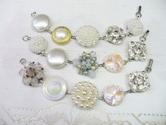 These gorgeous bracelets are fashioned from 'repurposed' vintage earrings. The earrings range from crystal clear rhinestones, faux pearls, ivory, crystals, Aurora Borealis - gold accents, silver accents -- all on silver tone and gold tone . Great bracelet for that special occasion, bride or bridesmaid. Wedding APPEAL! AMAZING sparkle for the BRIDE or bridesmaid! They sit on a bracelet that is aprox. 7.25 inches long and is matte silver tone - nickel free and oxidized. I use only top quality adhe Vintage Pearl White Wedding Jewelry, Vintage Pearl White Jewelry For Anniversary, Vintage Beaded Wedding Bracelets, Adjustable Vintage Pearl White Jewelry, Vintage Adjustable Pearl White Jewelry, Adjustable Vintage Charm Jewelry For Wedding, Vintage Pearl White Jewelry For Party, Adjustable Vintage Charm Wedding Jewelry, White Jewelry With Pearl Buttons For Parties