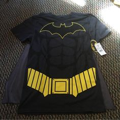 Nwt Batman Shirt With Velcro Cape. Perfect For Halloween! Comes From A Smoke Free And A Pet Free Home. Black Tops For Comic-con Fan Conventions, Black Tops For Comic-con, Casual Yellow Top For Halloween, Themed Crew Neck Top For Cosplay, Pop Culture Top For Halloween Cosplay, Easy Batman Costume, Black Shirt With Character Print For Cosplay, Black Pop Culture Shirt For Cosplay, Themed Graphic Print Tops For Cosplay