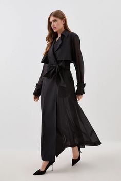 The new By Lydia: A Moment in Paris collection covers every dress code for the party season, featuring unique investment pieces that have a modern yet timeless feel.Exude a refined and elegant aesthetic in this sleek trench coat. Crafted with a sheer full skirt, this outerwear piece flows with every step. A wrap belt cinches the waist, while notched lapels ensure a classic look.Notched lapelsWrap beltSheer skirt Lydia Millen, Elegant Aesthetic, Sheer Skirt, Wrap Belt, Karen Millen, Dress Code, Fashion Face, Full Skirt, Dress Codes