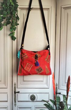 "Vintage Ethnic Shoulder Bag! In Mint condition!! This bag is made by fabric and leather materials. Zipper Working. Lining Black cotton! Measures: 12.6\" x 9.44\" (32 cm x 24 cm) Strap: 44.88\" (114 cm) Thanks for stopping by!!" Traditional Red Shoulder Bag For Everyday Use, Red Leather Handle Pouch Shoulder Bag, Handmade Red Hobo Bag For Travel, Traditional Red Bag For Everyday Use, Traditional Red Bags For Everyday Use, Traditional Red Bags For Everyday, Traditional Red Satchel Bag, Traditional Red Rectangular Satchel, Traditional Red Bag With Removable Pouch