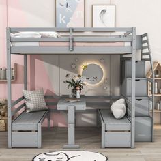 a bunk bed with desk and stools in a child's playroom or bedroom