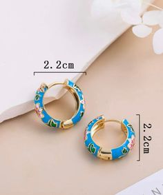 Spring is here. The flower is bloom most in spring are beautiful and incredible. They remind us the life growing. These little pieces make you feel every time great. Gold plated and zinc alloy. Sizes: 0.8in*0.8in. Hinge back hoop closure. Blue Hoop Earrings For Spring Gift, Trendy Hoop Earrings With Flower Charm For Spring, Spring Hoop Earrings With Flower Charm As Gift, Spring Hoop Earrings With Flower Charm, Spring Flower Charm Hoop Earrings As Gift, Round Spring Hoop Earrings, Spring Flower Hoop Earrings For Pierced Ears, Spring Round Hoop Earrings, Spring Gift Hoop Earrings With Flower Charm