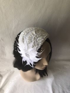 This is a vintage inspired half hat feather flower fascinator ideal for wedding, bridal tea party, mother of the bride, COGIC church hat or any other formal special occasion. Lightweight Can be worn either side Alligator clips underneath or elastic band White Gatsby Style Fascinator For Evening, Vintage White Fascinator For Evening, Vintage Headband For Kentucky Derby, Vintage White Evening Fascinator, Vintage Mini Hat Headband For Vintage Events, White Vintage Fascinator Hat, Vintage White Fascinator Hat, Vintage Wedding Fascinator Headband, Vintage White Wedding Costume Hats And Headpieces