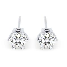 Sweet and simple, these stud earrings reflect your refined, sophisticated elegance. Each showcases a round stone in a traditional six-prong setting. Perfectly sized for her little ears, these classic and elegant stud earrings are a smart and stylish look anytime.Carat Weight: 0.55 ctStone Size: 4 mmStone Type: Jeulia® StoneNumber of Stones: 2 Stone Color: Diamond WhiteStone Shape: RoundWeight: 2 gWidth: 5.47 mmHeight: 4.34 mmMaterial: 925 SilverPlating Color: Silver Elegant Formal Earrings With Tension Setting, Everyday White Gold Solitaire Earrings, Classic Everyday Diamond Earrings With Matching Set, Timeless Earrings With Tension Setting For Anniversary, Elegant Diamond Earrings For Anniversary With Tension Setting, Elegant White Gold Earrings With Tension Setting, Classic Earrings With Tension Setting As Gift, Formal Earrings With Tension Setting And Round Cut, Classic Earrings With Tension Setting For Gift