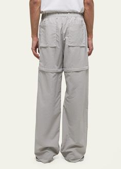 "Find HELMUT LANG Air Nylon Detachable Pants on Editorialist. Helmut Lang utility pants boast exposed cargo pockets and a detachable piece for versatile styling Approx. 33\" inseam Drawstring waistband Side slip pockets; back patch pockets Relaxed fit Full length Nylon Dry clean Imported" Spring Nylon Bottoms With Functional Pockets, Detachable Pants, Utility Pants, Back Patch, Helmut Lang, Drawstring Waistband, Full Length, Top Brands, Dry Clean