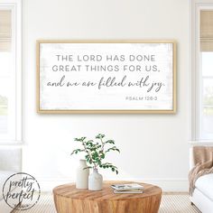 a living room with a coffee table and white walls