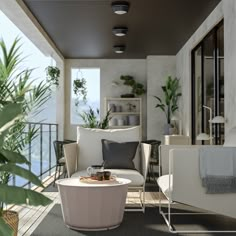 a living room filled with furniture and lots of plants on top of the floor next to a balcony