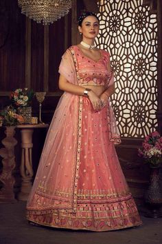 color-orange, fabric-net, work-embroidered, brand-name-krupali-savani,occasion-festivewear, occasion-wedding-guest, womenswear,ideal-for-women, lehengas, Product Features: Color: Orange Lehenga Fabric: Net Choli Fabric: Net Work: Embroidered Work Sleeves: Sleeveless Neck Type: Round Neck Wash Care: Dry Clean Occasion: Festivewear, Wedding Guest Product Type: Lehenga Choli with Dupatta Disclaimer: There will be slight difference in digital to actual image Festive Peach Anarkali Set With Intricate Embroidery, Traditional Peach Choli With Intricate Embroidery, Peach Anarkali Lehenga With Intricate Embroidery, Peach Traditional Wear With Intricate Embroidery For Wedding, Semi-stitched Peach Sharara With Intricate Embroidery, Peach Traditional Wear With Resham Embroidery For Reception, Pink Embroidered Net Lehenga, Traditional Net Sets For Reception, Festive Peach Lehenga With Intricate Embroidery