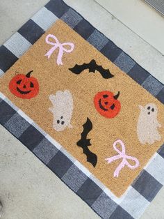 a door mat with halloween decorations on it