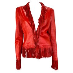 Presenting a fabulous bright red leather Gianni Versace jacket, designed by Donatella Versace. From the Spring/Summer 2002 collection, similar leather fringe pieces debuted on the season's runway. This vibrant leather jacket features woven accents, a deep neckline, and is made complete with leather fringe around the neck, closure, hem, and cuffs. Approximate measurements: Size - removed Shoulder to hem: 24" (including 4" hem) Bust: 36" - free Waist: 34" - free Shoulder to cuff: 24.5" Underarm to Fringe Skirt Outfit, Versace Leather Jacket, Versace Jacket, Red Fringe, Fringe Leather Jacket, Dior Haute Couture, Fits Clothes, Denim Skirt Women, Donatella Versace